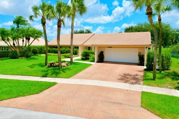 Complete outdoor kitchen with natural stone countertops and built-in appliances